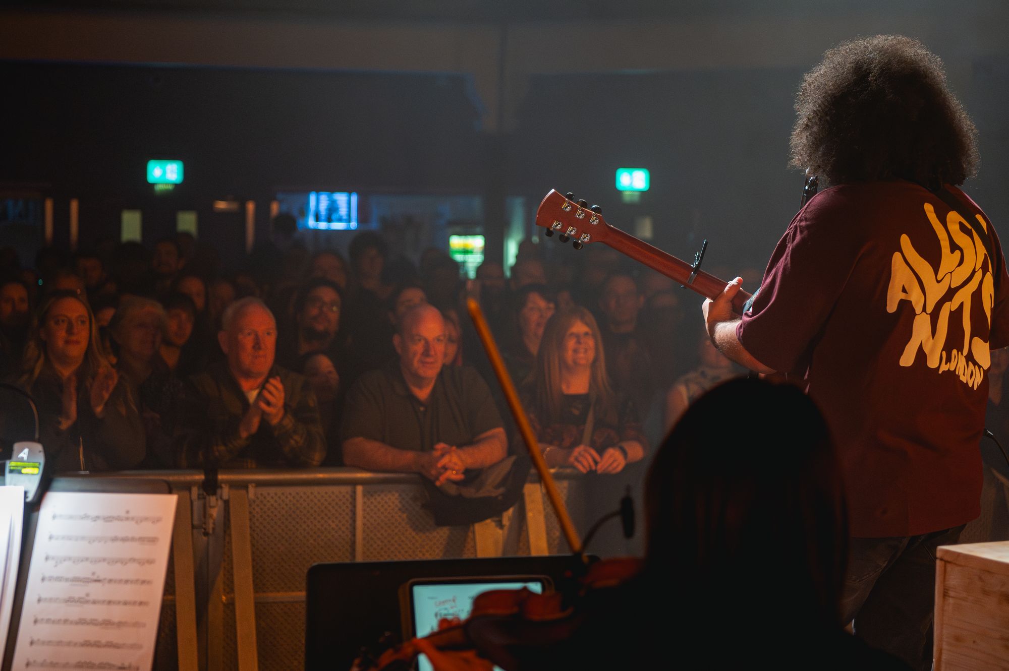Brownbear performing live under blue stage lighting